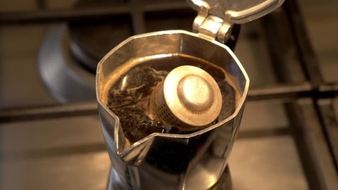 Italian boiling coffe in the coffeepot close up
