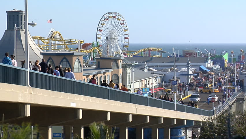 timelapse shot of a crowded Santa Monica Pier during the day