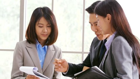 Asian people talking for business together. Business and and woman working together. People with business concept.