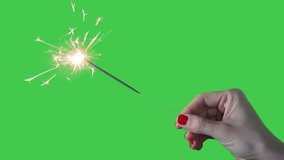 Hand holding sparkler HD footage isolated on green screen background.