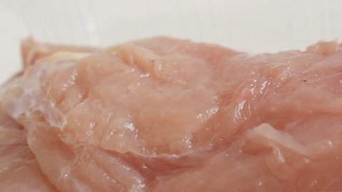 Fresh poultry meat 4K 2160p 30fps UltraHD panning video - Raw chicken breasts in a box close-up slow pan  3840X2160 UHD footage