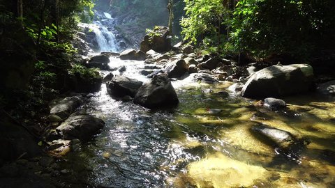 Small waterfall in Phang nga Thailand,4-K pan and tilt shot 