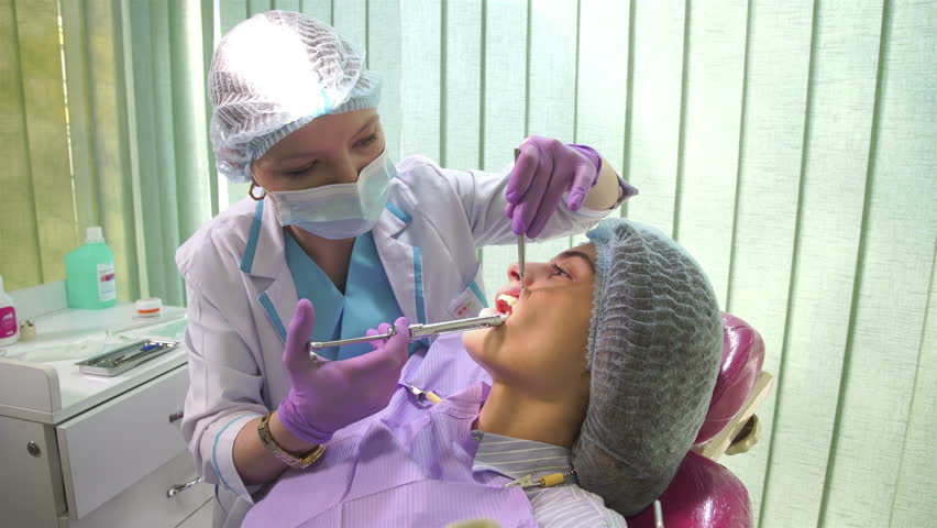 the dentist is making anesthesia to the patient  Royalty-Free Stock Footage #1007169964