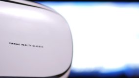 Virtual Reality glasses close up with blurred cororful VR background animation