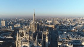 Aerial drone footage of famous statue on cathedral Duomo in Milan Italy // no video editing