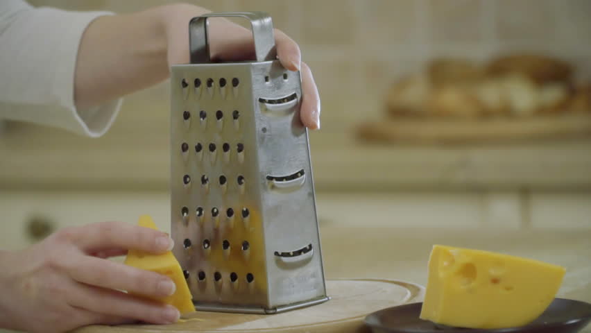 Woman Grating Cheese with Steel Arkivvideomateriale (100 % r
