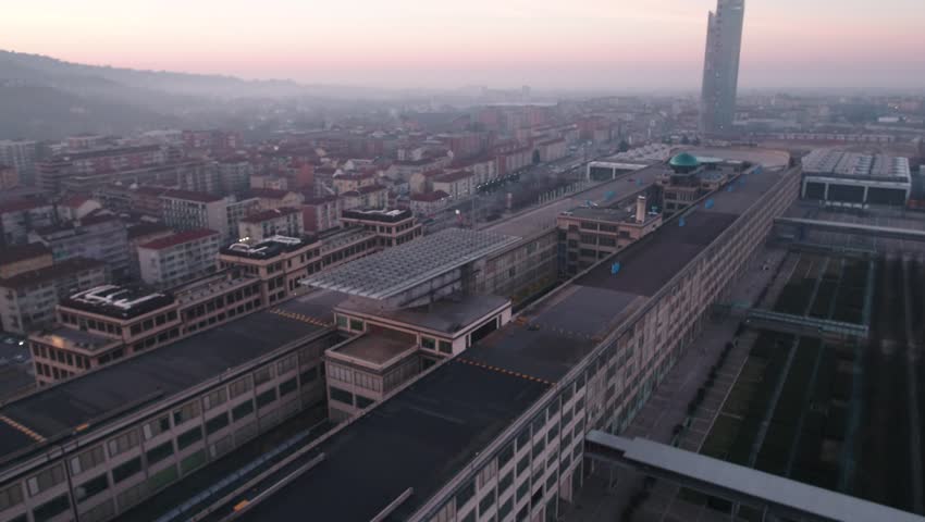 Aerial drone footage view of Lingotto overhead track in Torino Piemonte Italy sunset  // no video editing  Royalty-Free Stock Footage #1007172112
