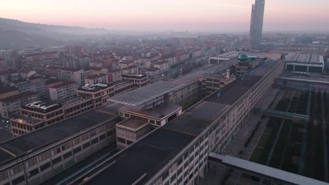 Aerial drone footage view of Lingotto overhead track in Torino Piemonte Italy sunset  // no video editing 