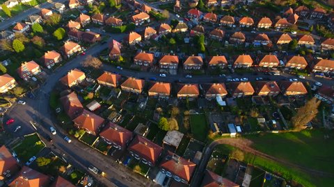 Aerial shot over the top of British housing estate in UK, English houses from above, semi detached homes 