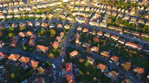 Aerial shot over the top of British housing estate in UK, English houses from above, semi detached homes 