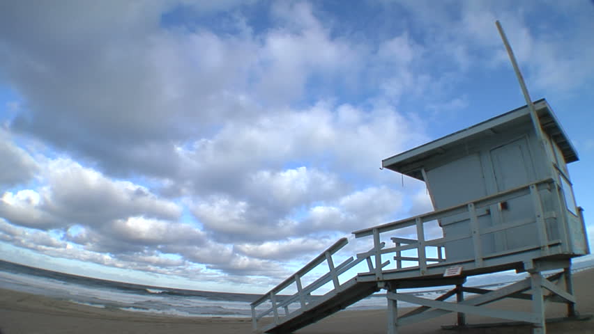 fish-eye lens shot of a lifeguard tower at Manhattan Beach, CA with clouds