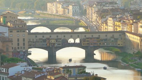 Florence Ponte Vecchio Bridge and City Skyline in Italy. Florence is capital city of the Italian region Tuscany. Florence was center of Italy medieval trade and wealthiest cities of era.