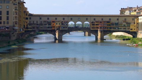 Florence Ponte Vecchio Bridge and City Skyline in Italy. Florence is capital city of the Italian region Tuscany. Florence was center of Italy medieval trade and wealthiest cities of era.