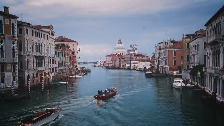 Venice Grand Canal skyline in Italy . As UNESCO world heritage, Venice is an important tourist destination in Italy with its beautiful cityscape, also busy port of Italy . Royalty-Free Stock Footage #1007187337