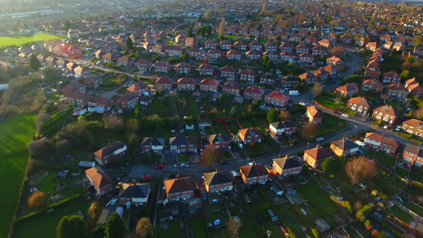 Aerial footage over a classic British housing estate, English houses and homes from above 