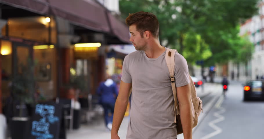 Portrait of loving young couple on London street. Happy and romantic male and female tourists smiling and laughing. 4k