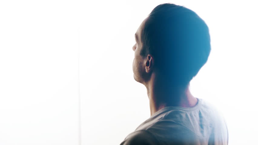 Silhouette of a man praying to God. Concept of faith and religion