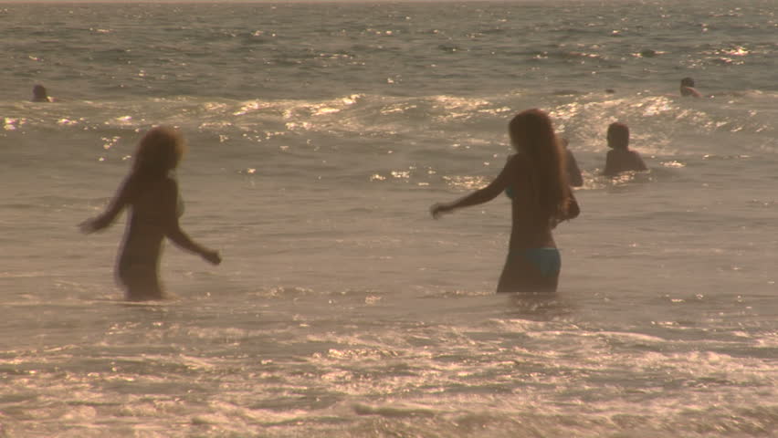 Girls play in a California Ocean