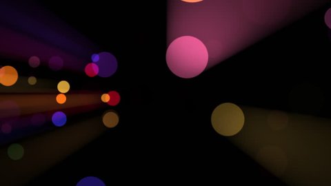 Flying Light Drops - Colorful Rainbow Particles In Rays - 4K Loop - Abstract background animation for VJ, holiday and fantasy music, film and design projects. Video de stock