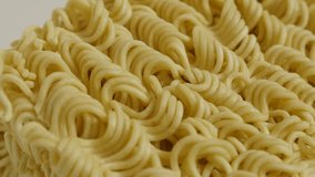 Popular instant food block ready for cooking 4K 2160p 30fps UltraHD footage - Surface of Chinese type  noodles close-up 3840X2160 UHD panning video