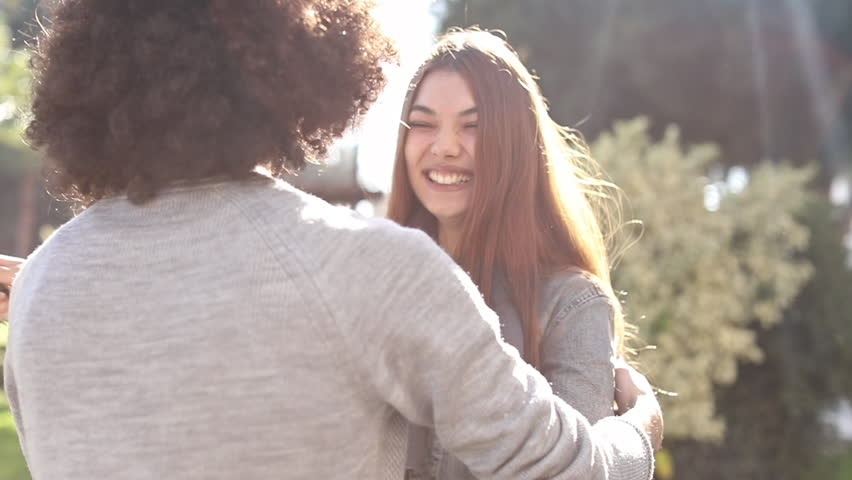 Young couple hugging each other in the park