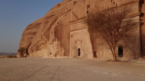 AlUla, Al Madinah Region / Saudi Arabia- September 23, 2017: Gimbal shot of a series of tombs at the Qasr al Bint area of Mada'in Saleh, the second largest settlement of the ancient Nabatean people. 