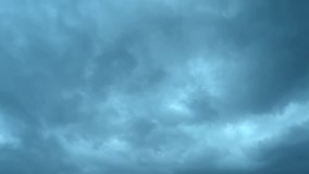 Nature Environment cloud sky, Dark purple clouds day to night time lapse. Purple black skies pass fly sky background. Dramatic with stormy weather, Grey, gray, blue, black clear moving fast. 4K.