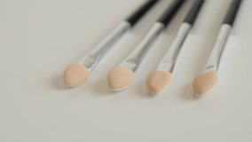 Slow pan on makeup eye brush set 4K 2160p 30fps UltraHD video - Collection of beauty treatment accessories 3840X2160 UHD panning footage