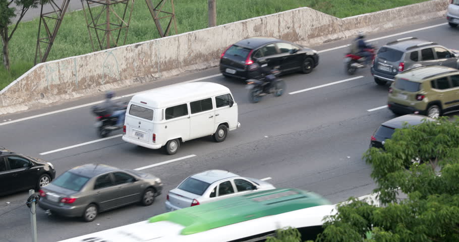 Moving traffic in 4K. Cars passing in avenue
