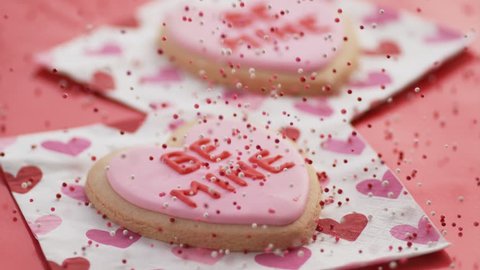 Valentine's Day cookies with sprinkles falling in slow motion.  Shot on Phantom Flex 4K.