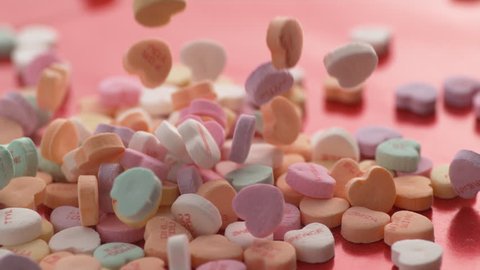 Valentine's Day heart shaped candy falling and bouncing in slow motion.  Shot on Phantom Flex 4K.