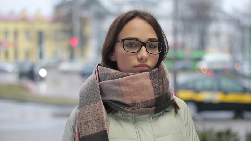 Portrait of a pretty young female looking at camera without smiling.