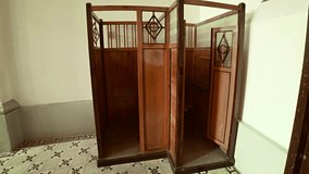 Hand crafted. hardwood confessional booth inside the Da Lat Cathedral. an important historical landmark in Vietnam. 4k video