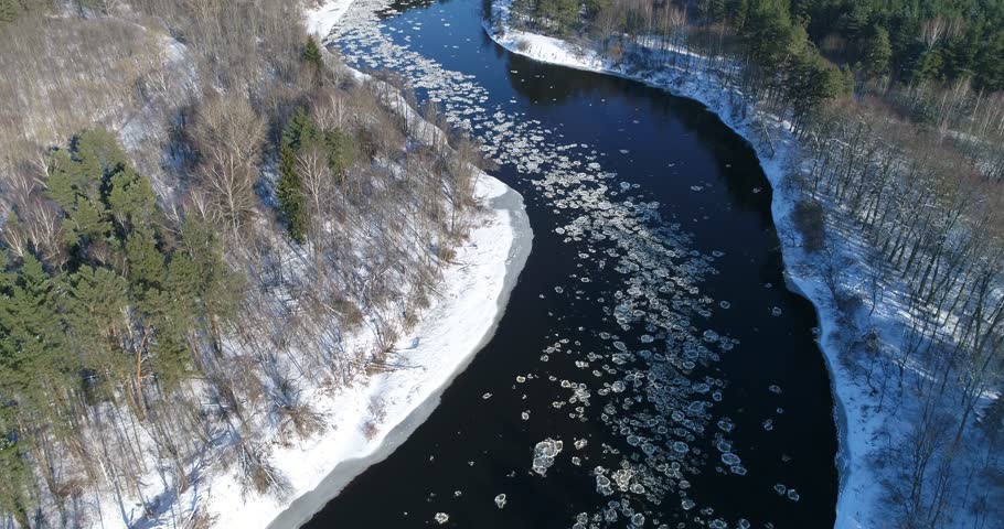 Ice floating on winter river. Aerial view drone footage