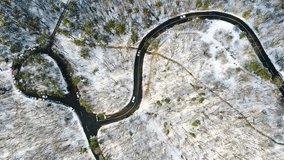 Aerial video of curvy road in forest 
