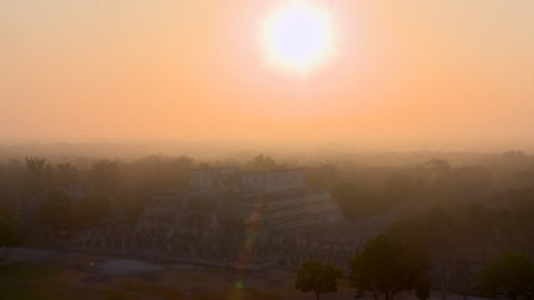 Sun rising above Mayan temple circa September 2010