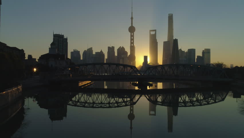 Panoramic Shanghai Skyline at Sunrise. Lujiazui Financial District and Huangpu River. China. Aerial View. Drone is Flying Upward and Sideways. Establishing Shot.
 Royalty-Free Stock Footage #1007252521