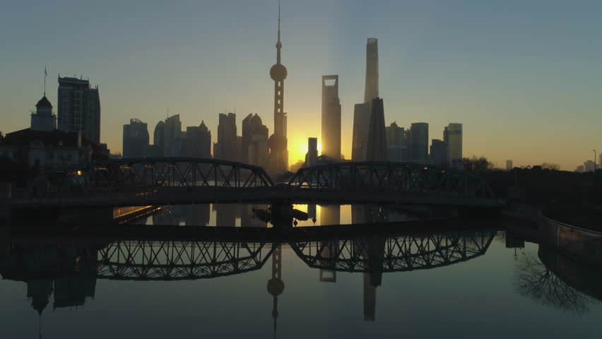 Panoramic Shanghai Skyline and Waibaidu Bridge at Sunrise. Lujiazui Financial District and Huangpu River. China. Aerial View. Drone is Flying Upward. Establishing Shot.
 Royalty-Free Stock Footage #1007252527