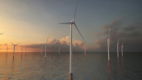 Offshore wind turbines at sunset. Wind Farm, renewable energy.