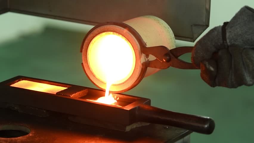 Melting gold. Molted metal pouring into bar form | Shutterstock HD Video #1007257999