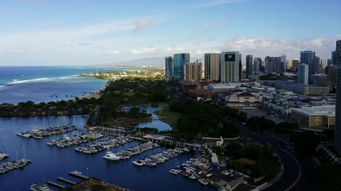 This video features a time-lapse of a passing rainstorm and rainbows at Ala Moana Harbor and the Honolulu cityscape on Oahu, Hawaii. Stock Video