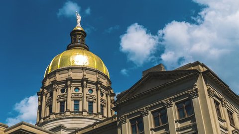 Close Up Time Lapse of Georgia State Capitol Building Dome with blue sky and clouds.