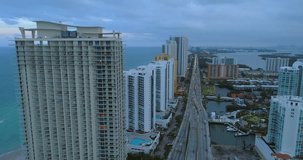 Aerial video drone flying over a highrise condominium Sunny Isles Beach
