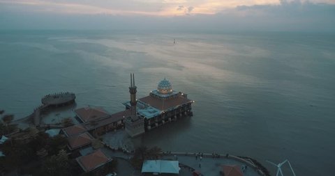 An aerial view of a floating mosque during sunset at Kuala Kedah, Malaysia.