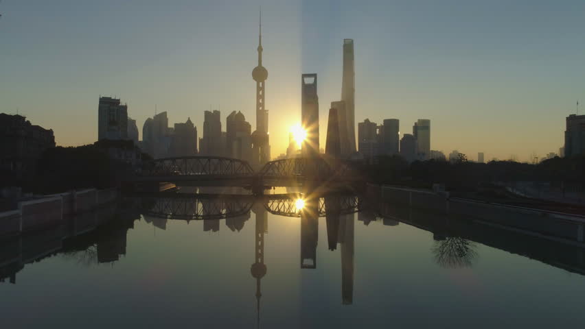 Shanghai Skyline at Sunrise at the Sunny Morning. China. Aerial View. Drone is Flying Over Waibaidu Bridge. Establishing Shot.
