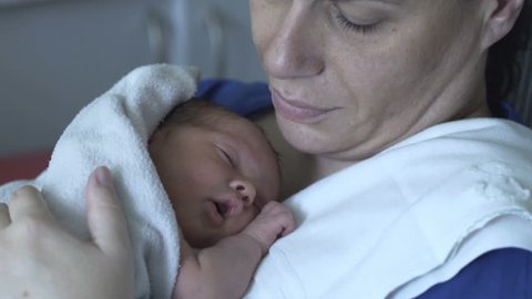 Newborn baby falling asleep and having a hiccup
