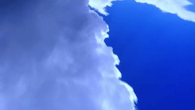 Time lapse clip of white fluffy clouds over blue sky, Towering Cumulus Cloud Billows, rain clouds in motion, timelapse of dramatic storm sky, 1920x1080, FHD.