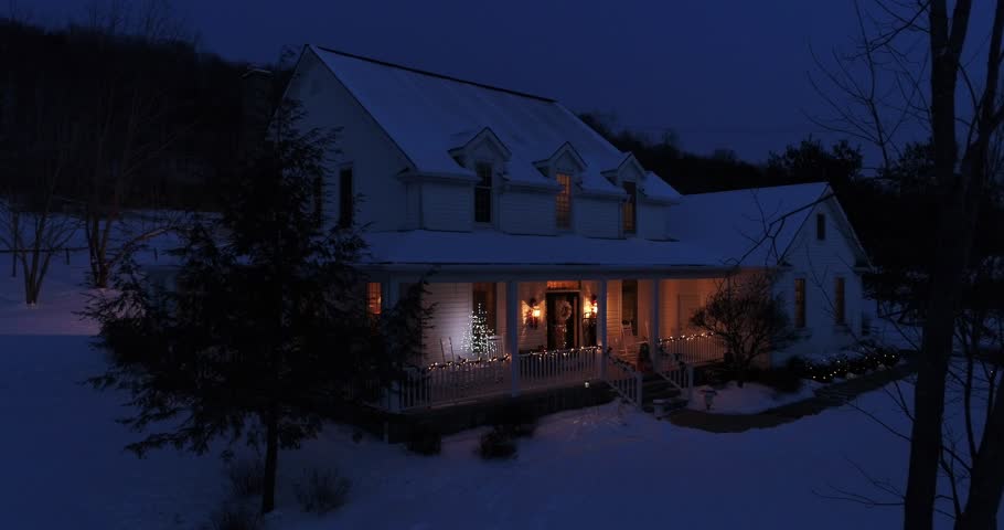 A slow aerial push into a Pennsylvanian farmhouse decorated for Christmas at night. Pittsburgh suburbs.  	
 Royalty-Free Stock Footage #1007303908