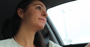 Woman driving car. Candid authentic real life 4K clip of young woman holding steering wheel and traveling somewhere