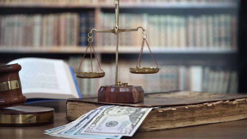 
Gavel of the judge in the courtroom with dollar bills Royalty-Free Stock Footage #1007310205